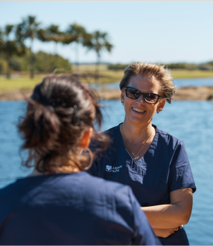 two nurses by the lake